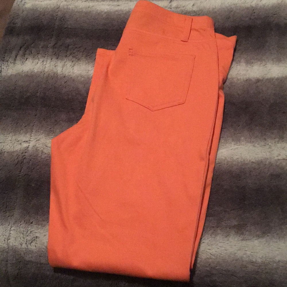 orange/peach colored jeggings